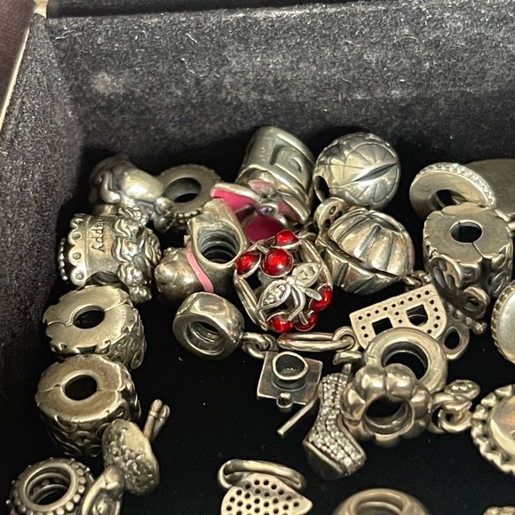 Lot of 26 Authentic Pandora charms.